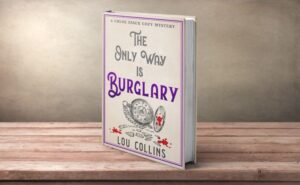 The Only Way is Burglary by Lou Collins, paperback on wooden shelf